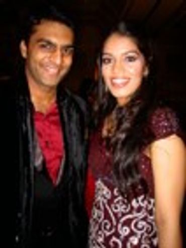 Man and woman posing together, smiling