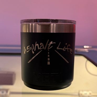Black Yeti cup with 'Asphalt Life' design and road graphic.