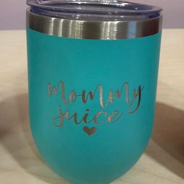 Blue tumbler with "Mommy Juice" text and a heart.