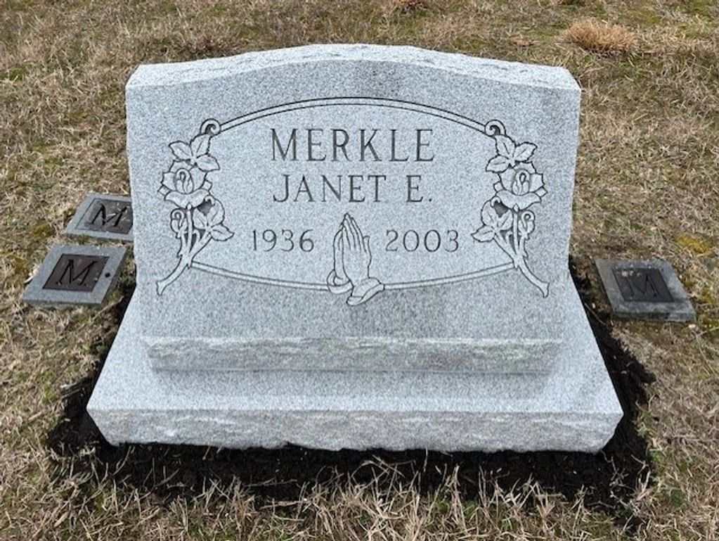 slant headstone on a base