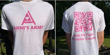Person wearing a white T-shirt with pink cancer awareness messages and QR code.