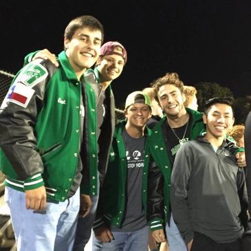 Clayton Winkles with friends at an Arlington High School football game