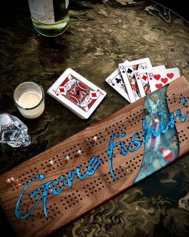 Play cribbage on a crib board.  Cribbage games come with polished pegs, peg storage & cribbage rules