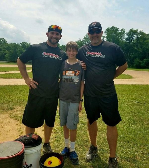 Former MLB players Casper Wells and Jay Witasick with a camper.