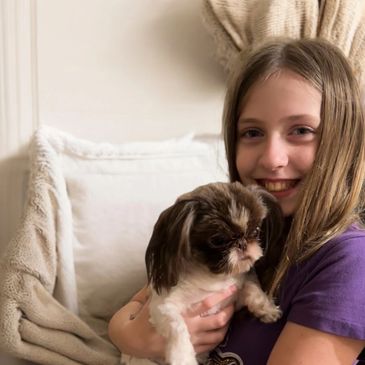My daughter, Haley! We call her the puppy whisperer.