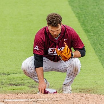 Baseball player preparing on the field.