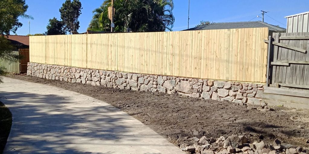 Rock Retaining wall & Timber Fence