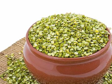 dal moong chilka split green moong in wooden bowl