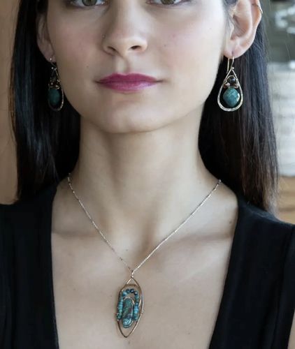 Sculpting with wire and gems, this is by Art By Any Means.