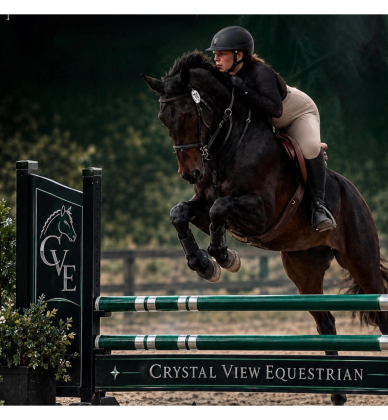 Equestrian jumping over an obstacle.