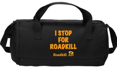 Black duffel bag with orange text saying 'I STOP FOR ROADKILL'.