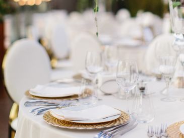 A table with plates and wine glasses