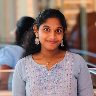 Young woman smiling softly at the camera.