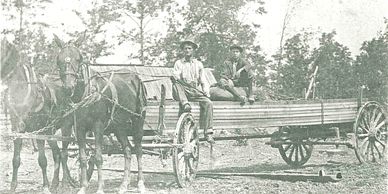 Cebe & Frank Norman, hauling lumber in Clarkrange area, in 1918