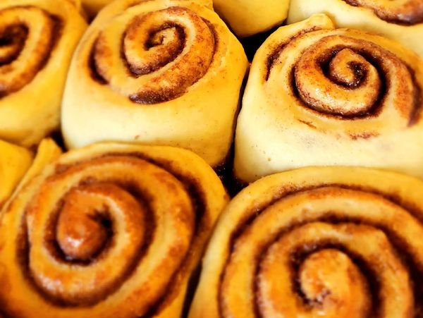 Freshly baked cinnamon rolls with golden-brown swirls.