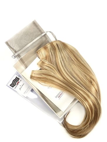 Blonde tape-in hair extensions with packaging and storage pouch.
