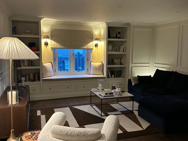 Cozy modern living room with plush seating and warm lighting.