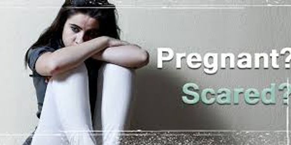 Worried young woman with pregnant and scared text.