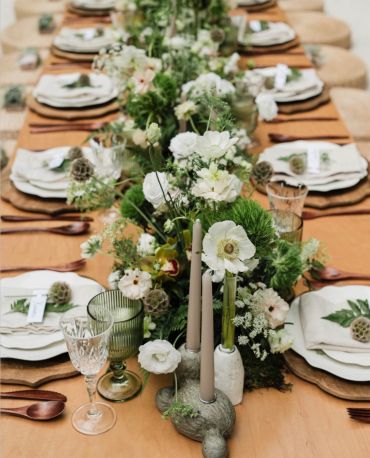Elegant floral centerpiece on a rustic dining table.