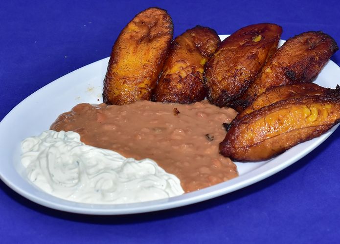 SWEET FRIED PLANTAINS WITH SOUR CREAM AND REFRIED PINTO BEANS