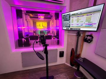 Vocal recording setup inside The Lab Studios NYC with microphone and studio booth lighting. protools