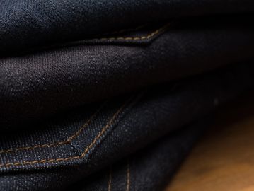 Pile of denim jeans
