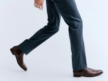 Man walking in dress slacks and leather shoes