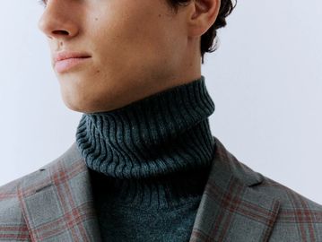 Man in turtleneck sweater and sportcoat