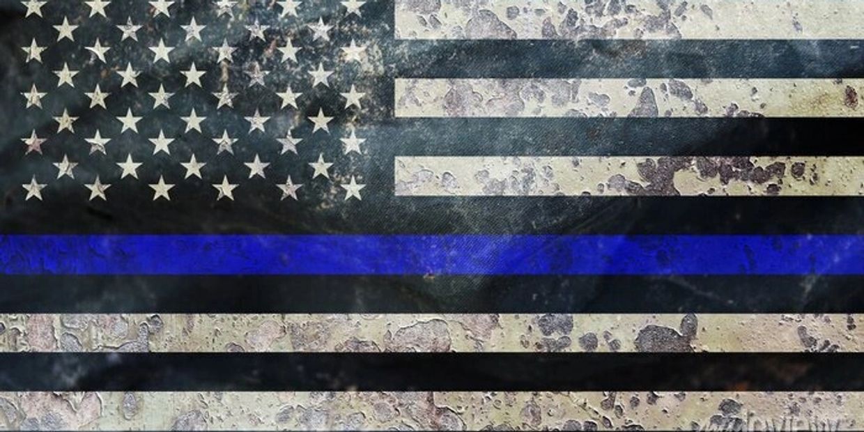 Distressed Thin Blue Line American flag symbolizing law enforcement support.