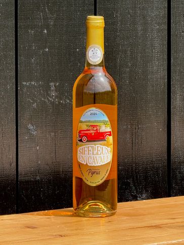 A bottle of Siffleux En Cavale Pyrus wine with a vintage red truck label.