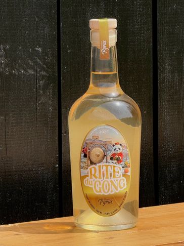 A bottle of RITE du GONG Pyrus spirit with a panda and gong label design.