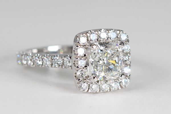 Halo cushion-cut diamond ring