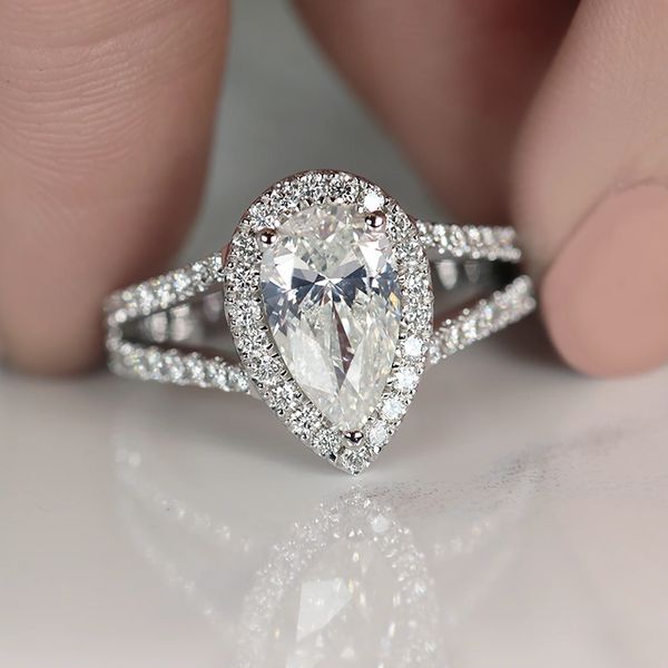 Halo pear-shaped diamond ring