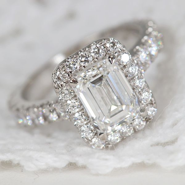 Halo emerald-cut diamond ring