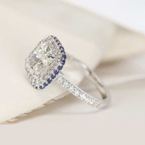 Halo and hidden sapphire halo cushion-cut diamond ring