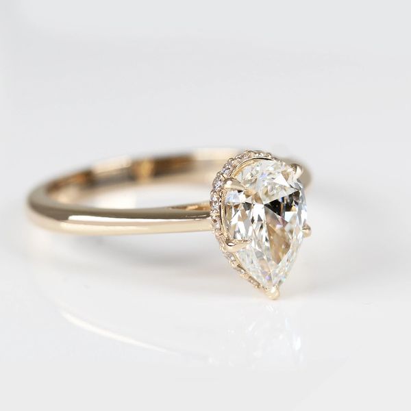 Hidden halo pear-shaped diamond ring