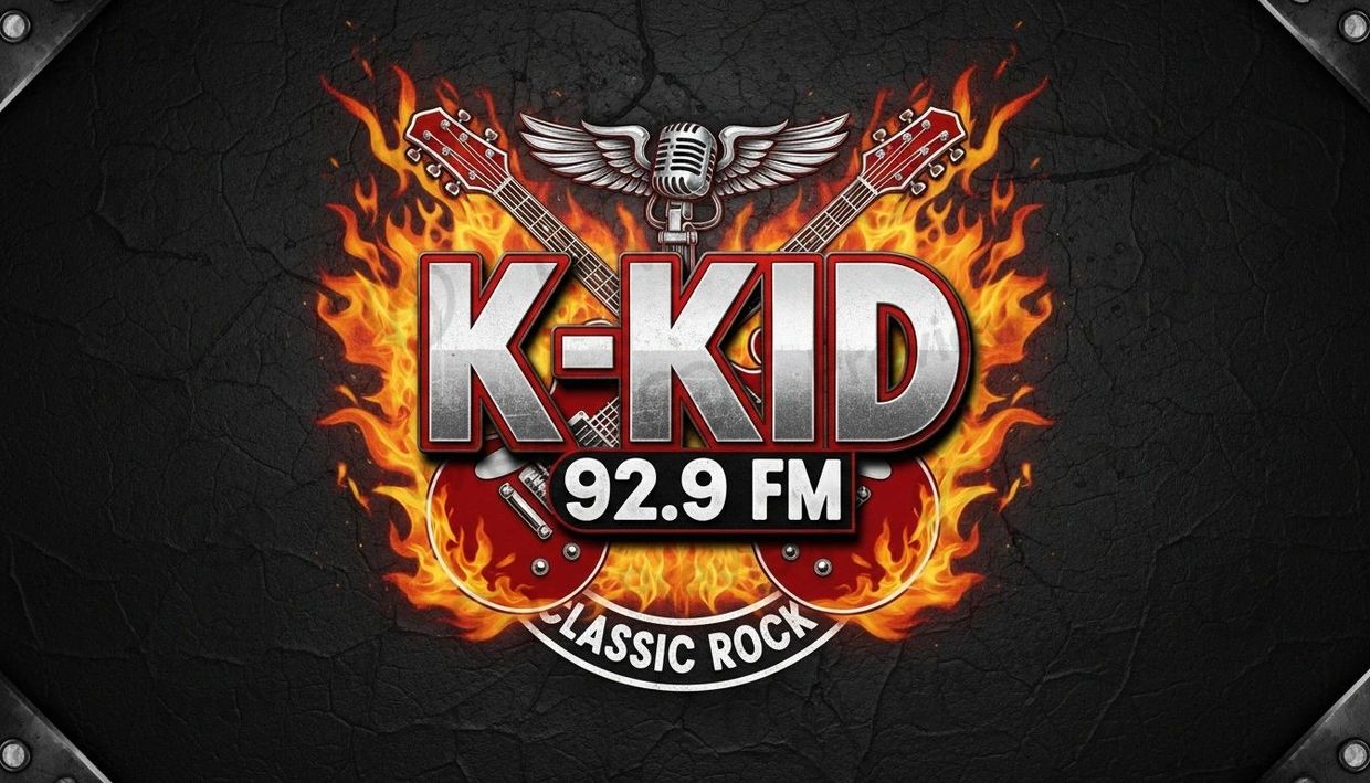K-KID 92.9 FM classic rock logo with flaming guitars and microphone.
