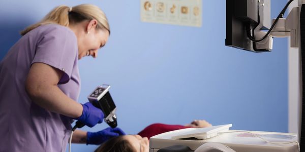 Medical professional performing a procedure on a patient.