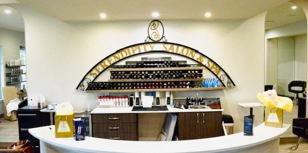 Reception area of Serendipity Salon & Spa with nail polish display.