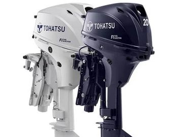 Two Tohatsu outboard motors, one white and one black.