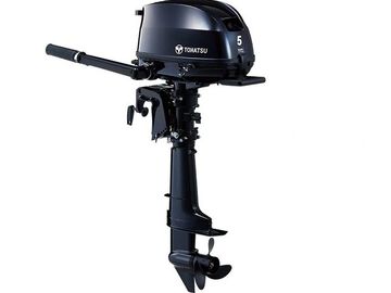 Black 5 HP Tohatsu outboard motor.