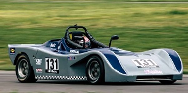 A sleek race car on a track with number 131.