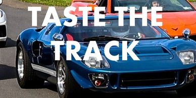 Classic sports cars racing on a track at Pineview Run event.