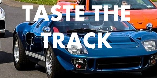 Classic sports cars racing on a track at Pineview Run event.