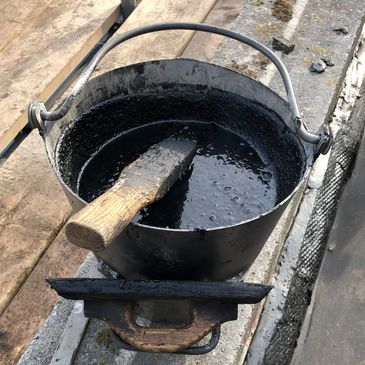 Mastic asphalt is melted from block form, poured into buckets then laid by hand using a float.