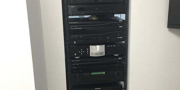 A rack filled with AV and stereo equipment.