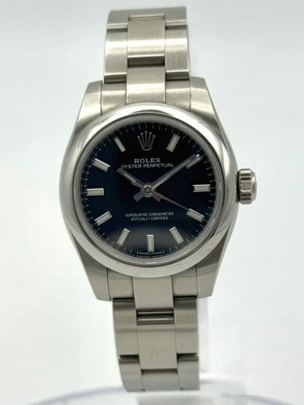 Rolex Oyster Perpetual stainless steel wristwatch with black dial.