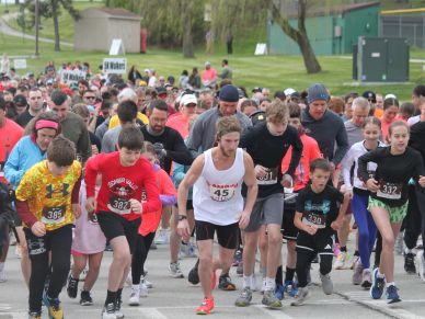 A group of runners starting a race outdoors.