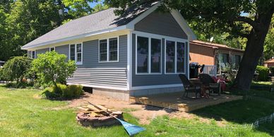 Home Addition living room space deck concrete foundation vinyl siding windows doors roof 