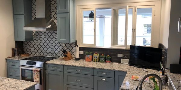 kitchen remodeling cabinets counter top tile flooring lighting electrical plumbing sink back splash m